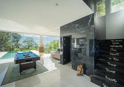 a living room with a ping pong table at Villa Ocean Jungle View Infinity Pool Near Samara in Carrillo