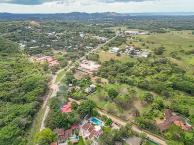 an aerial view of a village with houses and trees at Villa Toscana Tamarindo- Elegant villa in Garita