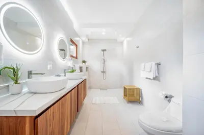 a white bathroom with two sinks and a mirror at Villa Toscana Tamarindo- Elegant villa in Garita