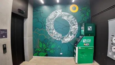 a wall with a painting of a symbol on it at Apartment with air conditioning and 20 minutes from the airport in San José