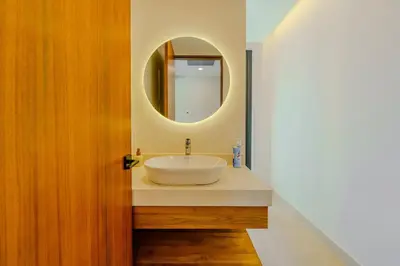 a bathroom with a sink and a mirror at Casa Nimbu - Hacienda Pinilla in Tamarindo