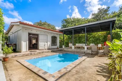 a swimming pool in the backyard of a house at Tropical Oasis with Casita — Minutes to Tamarindo in Villarreal