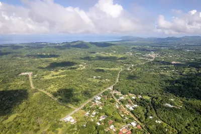 an aerial view of a town in the middle of a forest at Tropical Oasis with Casita — Minutes to Tamarindo in Villarreal