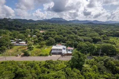 an aerial view of a building in the middle of a forest at Tropical Oasis with Casita — Minutes to Tamarindo in Villarreal