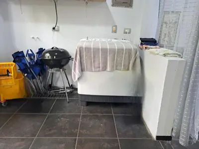 a room with a table with a blanket on it at Costa Verde Retreat 1 - Ground Floor in Quepos