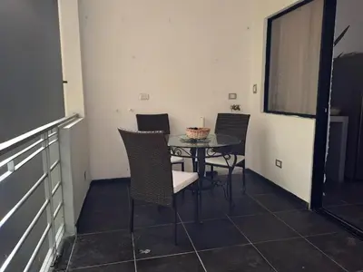 a dining room with chairs and a table in a room at Costa Verde Retreat 2 - Upper Floor in Quepos