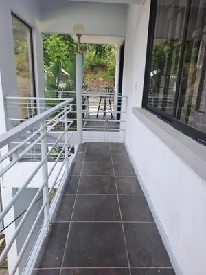 a porch with a view of a table at Costa Verde Retreat 2 - Upper Floor in Quepos