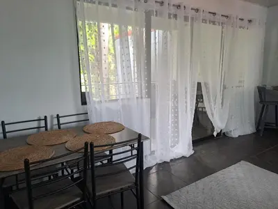 a room with a table and chairs and a window at Costa Verde Retreat 2 - Upper Floor in Quepos