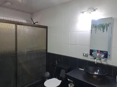 a bathroom with a sink and a toilet and a mirror at Costa Verde Retreat 2 - Upper Floor in Quepos