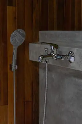 a shower in a bathroom with a shower head at Casa Coyota Hotel in Monteverde Costa Rica