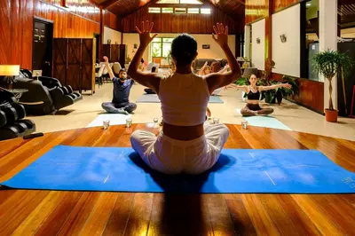 a woman sitting on the floor in a yoga class at Casa Coyota Hotel in Monteverde Costa Rica