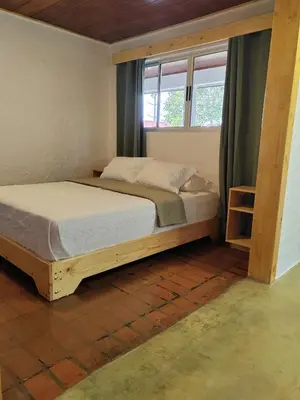 a bedroom with two beds and a window at Apartamento Agapanto, descanso, ocio o trabajo in La Asunción