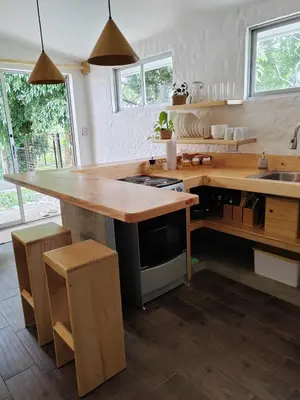 a kitchen with a wooden counter top and a sink at Apartamento Agapanto, descanso, ocio o trabajo in La Asunción