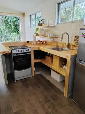 a kitchen with a sink and a stove at Apartamento Agapanto, descanso, ocio o trabajo in La Asunción