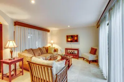 a living room with a couch and a table at The Cove 7/8 at Playa Ocotal in Ocotal