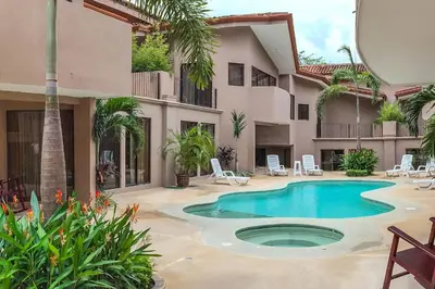 a courtyard with a swimming pool in a house at The Cove 7/8 at Playa Ocotal in Ocotal