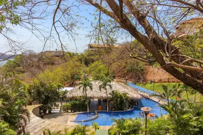 a view of the pool at the resort at Villa Sol 36 in Playa Hermosa