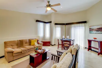 a living room with a couch and a table at The Cove 5/6 at Playa Ocotal in Ocotal