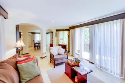 a living room with a couch and a table at The Cove 5/6 at Playa Ocotal in Ocotal