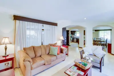 a living room with a couch and a table at The Cove 5/6 at Playa Ocotal in Ocotal