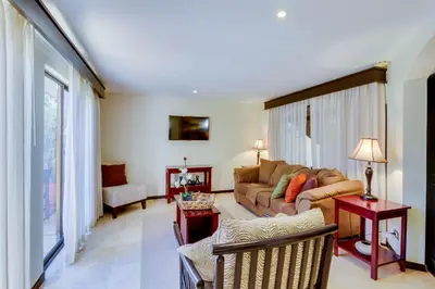 a living room with a couch and a table at The Cove 5/6 at Playa Ocotal in Ocotal