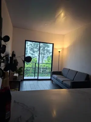 a living room with a couch and a large window at Villa Kaza Proyecto in Santa María