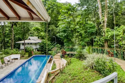 a backyard with a swimming pool and a garden at Pools Bungalow at Toucan in Coronado