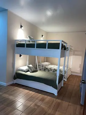 a bedroom with two bunk beds in a room at Vacation Home with Pool Quepos in Quepos