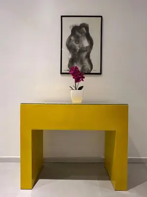 a yellow bench with a flower on top of it at Backyard Beach House Oceanfront Luxury 5 Bdr in Playa Hermosa