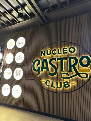 a sign for a nintendogasgas club on a wall at Modern Condo in Núcleo La Sabana with Pool in San José
