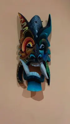 a mask hanging on a wall at Green Shelter in Quepos
