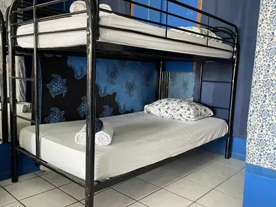 a bedroom with two bunk beds in a room at Beach Studio for 4 - AC - WiFi - Parking Santa Teresa in Santa Teresa
