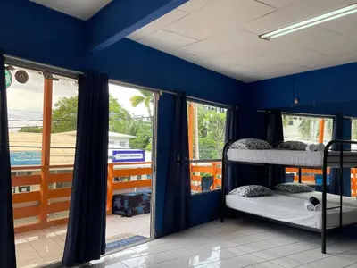 two bunk beds in a room with blue walls at Beach Studio for 4 - AC - WiFi - Parking Santa Teresa in Santa Teresa