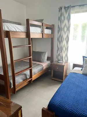 a room with two bunk beds and a bed at Casa Bella 3 Bdrm House w Pool in Gated Community in Cuajiniquil