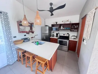a kitchen with a white counter top in a room at Casa Bella 3 Bdrm House w Pool in Gated Community in Cuajiniquil