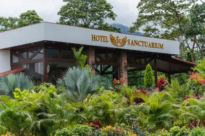 a hotel sanctuary with plants in front of it at Hotel Sanctuarium in Fortuna