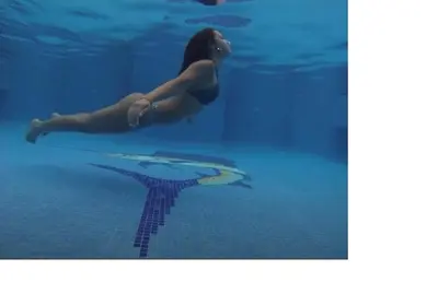a woman swimming in the water in a pool at Rancho RachMare in Playa Coyote, a Beach Home! in Nandayure