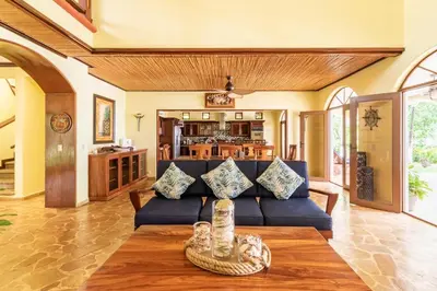 a living room with a couch and a table at Rancho RachMare in Playa Coyote, a Beach Home! in Nandayure