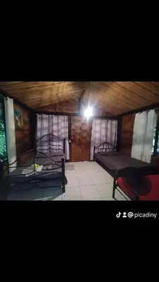 a room with two bunk beds and a light at Wildlife Reserve La Ceiba Ecoadventures in Platanillo