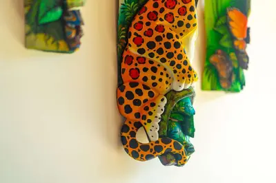 a decoration of a peacock on a wall at NEW-Gated-Panoramic sunset ocean view-pool-4 suite in Ojochal