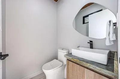a bathroom with a sink and a mirror at Uvita-New luxury-sleeps 6-private pool-huge patio in Uvita