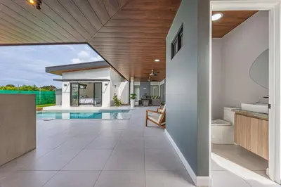 an open hallway of a house with a swimming pool at Uvita-New luxury-sleeps 6-private pool-huge patio in Uvita