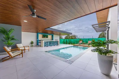 an indoor swimming pool in a house with a wooden ceiling at Uvita-New luxury-sleeps 6-private pool-huge patio in Uvita