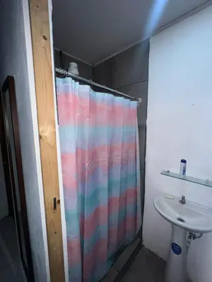 a shower curtain in a bathroom with a sink at Vicky's Room - NO PARKING SITE in Santiago Este