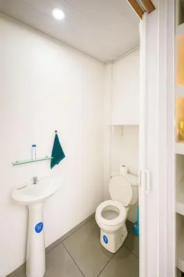 a bathroom with a toilet and a sink at Vicky's Room - NO PARKING SITE in Santiago Este