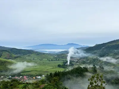 a view of a valley with a steam train at Mountain Retreat Refugio de Aves in Turrialba