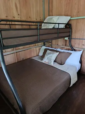 a couple of bunk beds in a room at Mountain Retreat Refugio de Aves in Turrialba