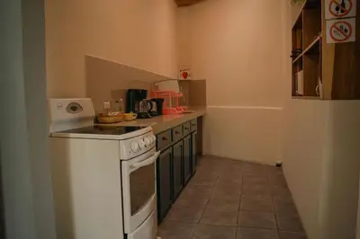 a kitchen with a stove and a counter top at 5-minute walk downtown apartment in Fortuna