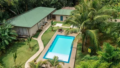an aerial view of a house with a swimming pool at Villa Marala in Esterillos