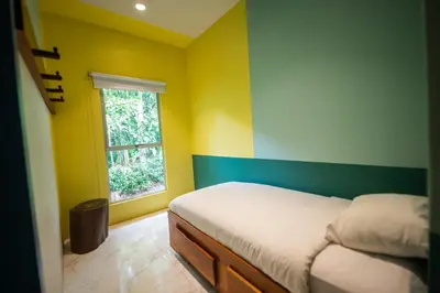 a bedroom with a bed and a window at Villa Marala in Esterillos